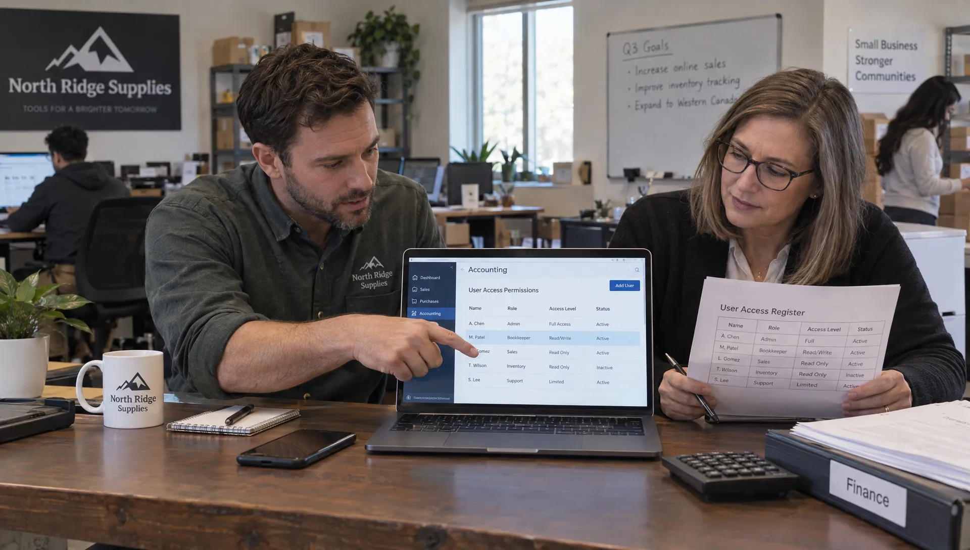 A business owner and bookkeeper review user permissions and an access register for accounting records.